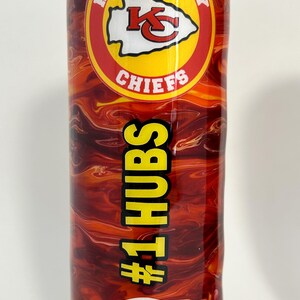 May include: A red and yellow stainless steel tumbler with a Kansas City Chiefs logo and the text "#1 HUBS".
