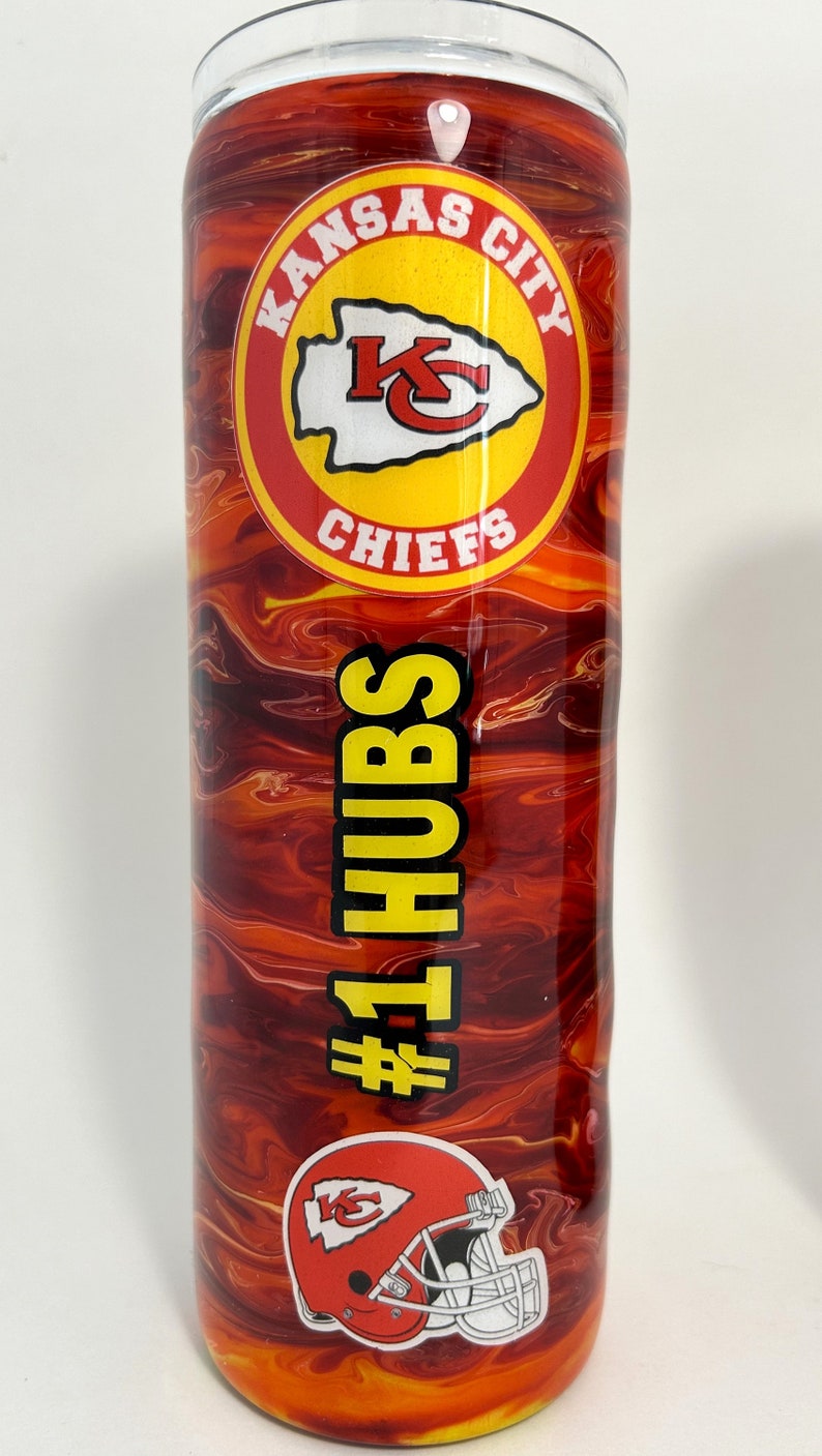May include: A red and yellow stainless steel tumbler with a Kansas City Chiefs logo and the text "#1 HUBS".