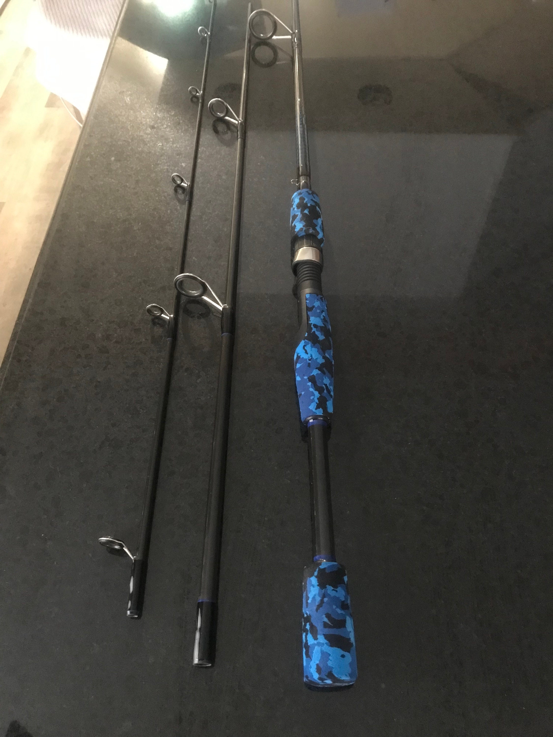 Custom Blue Camo spinning rod with feather inlays.