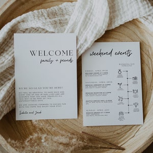 May include: A white welcome card with black text that says "Welcome family + friends" and a welcome message. A second white card with black text lists a weekend event schedule with a timeline of events for a wedding.