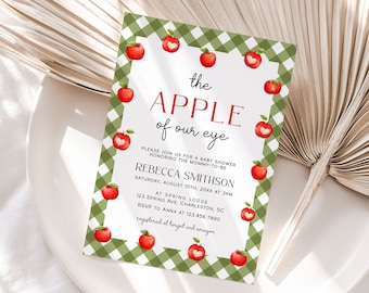 May include: A green and white gingham patterned baby shower invitation with red apples and the text "the APPLE of our eye". The invitation includes the name "Rebecca Smithson" and details for the baby shower.