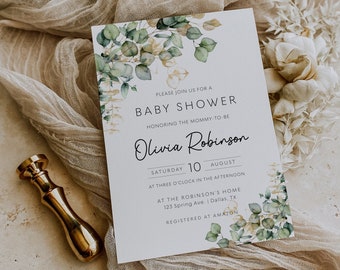 May include: A white baby shower invitation with a watercolor illustration of green leaves and gold accents. The text reads "Please join us for a Baby Shower honoring the mommy-to-be Olivia Robinson Saturday 10 August at three o'clock in the afternoon at the Robinson's Home 123 Spring Ave. Dallas, TX Registered at Amazon."