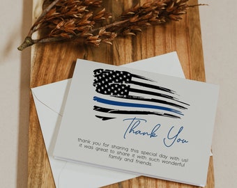 May include: A white card with a blue line and an American flag design. The card says "Thank You" and includes the text "thank you for sharing this special day with us! It was great to share it with such wonderful family and friends."