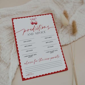May include: A baby shower game card with a red scalloped border and cherry illustration. The card features prompts for predictions and advice, including date of birth, birth weight, and eye color. The text is in red script.