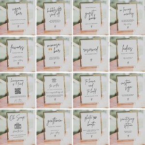 May include: A set of 16 gold-framed signs with white backgrounds and black text. The signs feature various wedding-related themes, such as "cigar bar", "bubbles send off", "guest book", "in loving memory", "favors", "mimosa bar", "reserved", "ladies", "honeymoon fund", "the smilers", "to have and to hold", "custom sign", "oh snap", "gentlemen", "photo booth", and "sanitizing station".