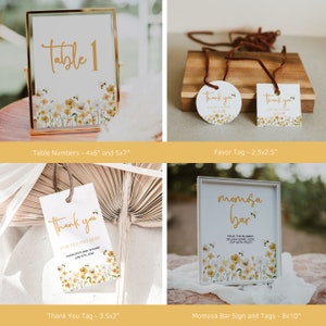 May include: A set of printable baby shower decorations featuring a floral design with bees. The set includes table numbers, favor tags, a thank you tag, and a sign for a mimosa bar. The text on the sign reads "mimosa bar" and includes instructions for making a mimosa. The text on the thank you tag reads "thank you for bee-ing here".