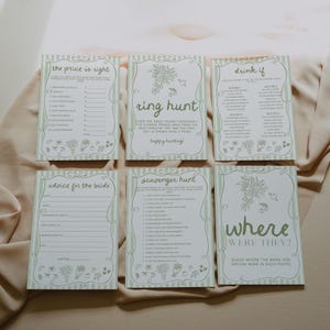 May include: Six white and green bridal shower game cards with various game titles, including "The Price is Right," "Ring Hunt," and "Where Were They?" Each card has a decorative border and floral accents.