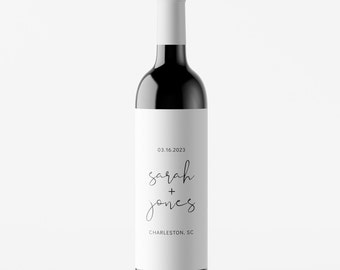 May include: A white wine bottle label with the text "03.16.2023", "sarah + jones", and "CHARLESTON, SC".