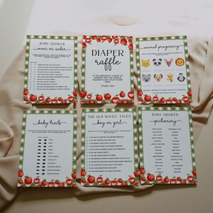 May include: A set of printable baby shower game cards with a red and green gingham pattern and apple illustrations. The games include "Over or Under", "Diaper Raffle", "Animal Pregnancy", "Baby Traits", "The Old Wives Tales: Boy or Girl", and "Baby Shower Pictionary".