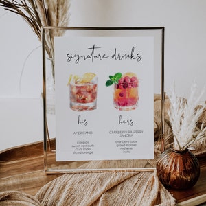 May include: A printable sign with the text "signature drinks" and two watercolor illustrations of cocktails. The left cocktail is labeled "his" and "Americano" with ingredients listed below. The right cocktail is labeled "hers" and "Cranberry-Raspberry Sangria" with ingredients listed below.