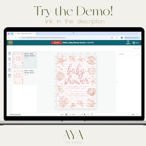 May include: A laptop screen displaying a web-based design interface for a baby shower game card. The card features a light pink background with rose gold seashell and coral illustrations, and the text "baby shower" in a cursive script font.