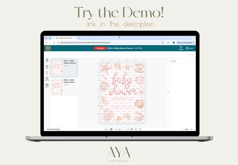 May include: A laptop screen displaying a web-based design interface for a baby shower game card. The card features a light pink background with rose gold seashell and coral illustrations, and the text "baby shower" in a cursive script font.