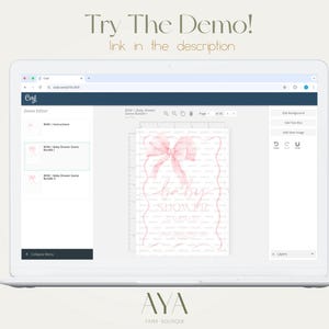 May include: A laptop displays a baby shower invitation design with a pink bow and the words "baby shower". The screen also shows the text "Try The Demo!" and "link in the description". The laptop is on a light beige background.