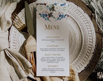 May include: A white menu card with a floral design and gold lettering. The menu lists appetizers, starters, main course, and dessert. The text on the menu reads: "MENU", "APPETIZERS", "chilled gazpacho with dressed crab", "STARTERS", "goat cheese agnolotti with forest vegetables & essence of tomato", "MAIN COURSE", "pan seared fillet of Scottish salmon with a crispy fried squid, gingered vegetables with sweet chilli dressings", "DESSERT", "lemon shortcake with fresh Scottish raspberries & mango sorbet".