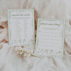 May include: Two light green and white striped game cards with the text "I Love You Around the World" and "Where Were They?". The cards have decorative floral and bow accents. The "I Love You" card has a matching game with language translations.