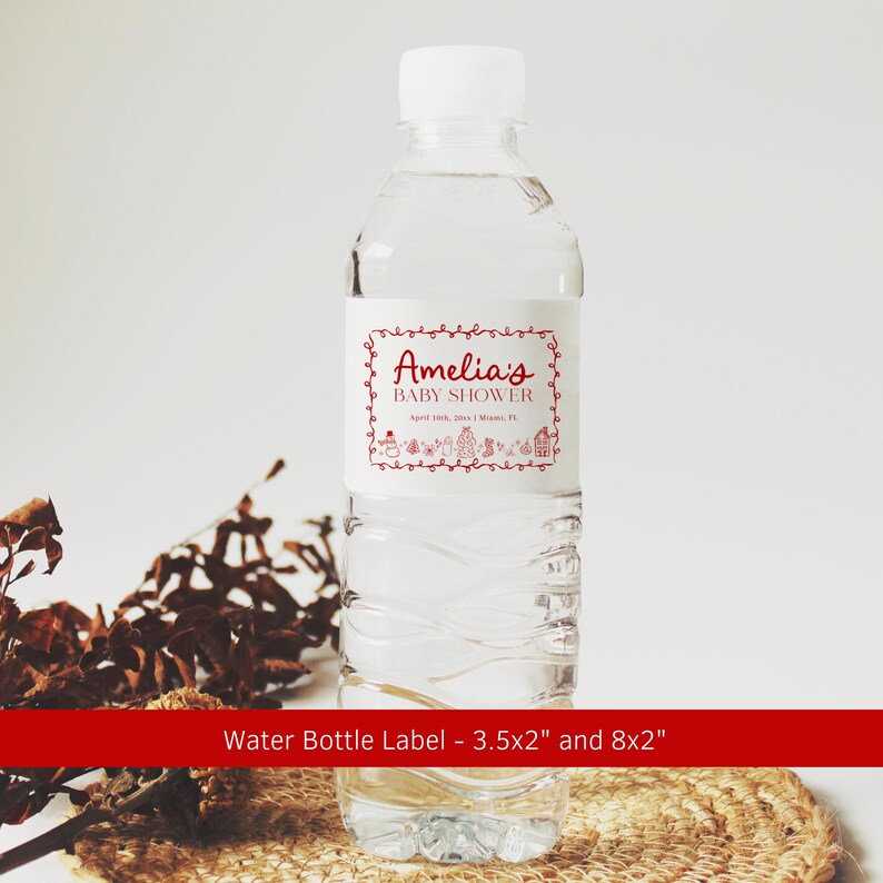 May include: A clear plastic water bottle with a white cap and a label that reads "Amelia's BABY SHOWER" in red script. The label has a decorative border and small illustrations. The text "April 10th, 2014 | Miami, FL" is also on the label.