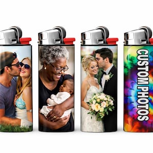 May include: Four custom lighters with silver tops and red accents. The lighters feature different images: a couple kissing, a woman holding a baby, a couple at a wedding, and a tie-dye design with the text "CUSTOM PHOTOS."