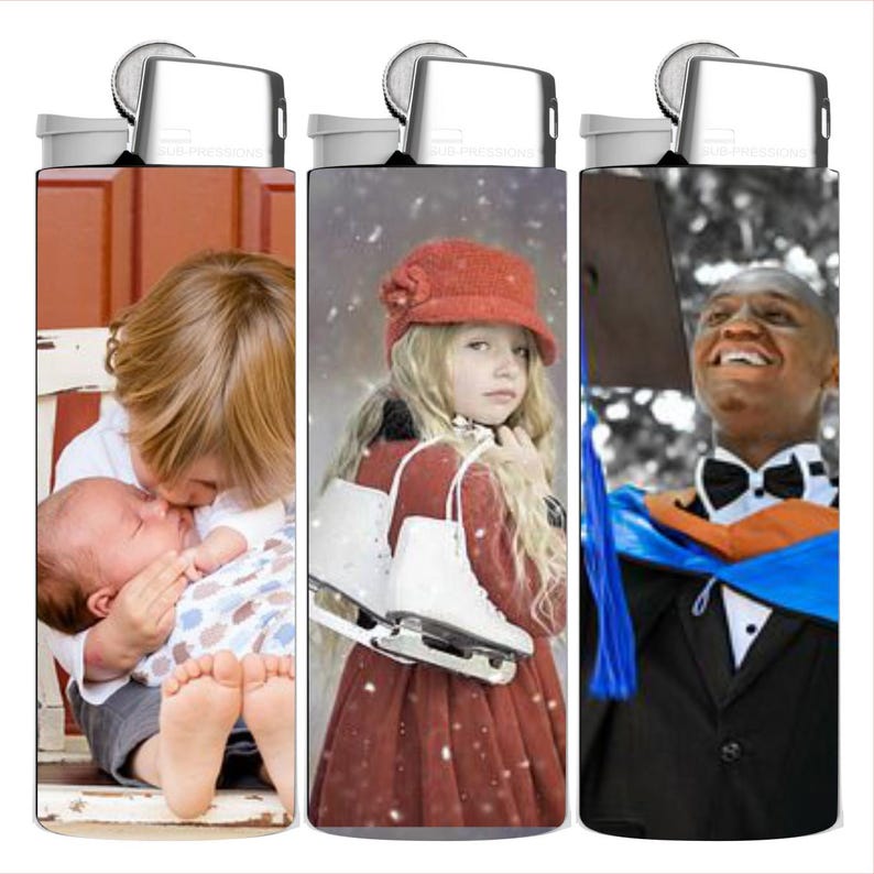 May include: Three refillable lighters with different images. One shows a child kissing a baby, another a girl with ice skates, and the last a graduate in a cap and gown. Each lighter has a silver top.