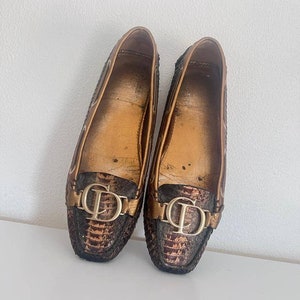 Christian Dior leather mocassion loafers with art python derlrltails and CD ornament