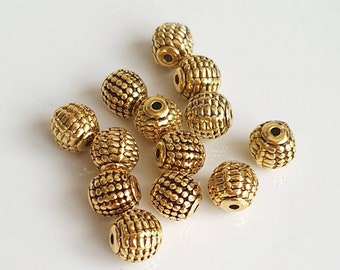 Perles style tibétain en alliage or antique 9 mm. Lot de 5.