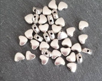 Antique silver heart beads. Pack of 10.