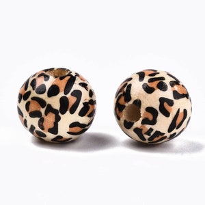 Natural wooden beads with printed imitation leopard skin. 12mm. Pack of 25.