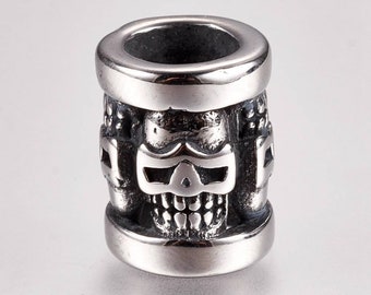 Tibetan style skull tube beads in 304 stainless steel. Sold individually.