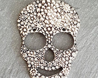 Mexican Calaveras skull pendants.