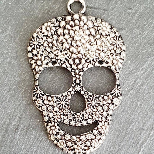 Mexican Calaveras skull pendants.