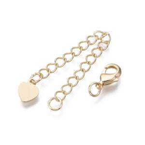 Chain extension with heart 7 cm in 18k gold plated. Sold individually.