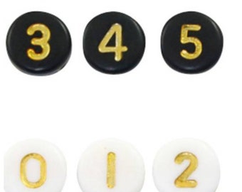 Acrylic number beads. From 0 to 9. Golden white or golden black. 7mm. Sold individually or in sets of 5.