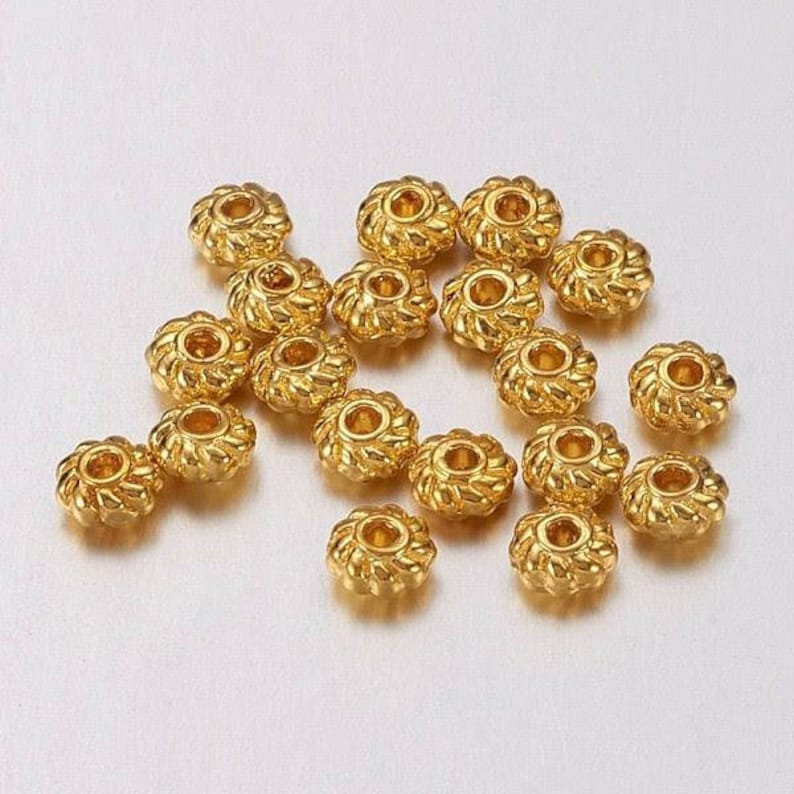 4mm Lot of 20 beads. Gold Infill beads in alloys