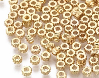 Perles rondelles torsion en plaqué or 18k. 4mm. Lot de 10.