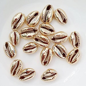 Golden shell cowrie beads. Set of 3.