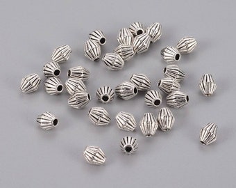 Perles séparateurs style tibétain toupie en alliage. 5mm. Lot de 10.