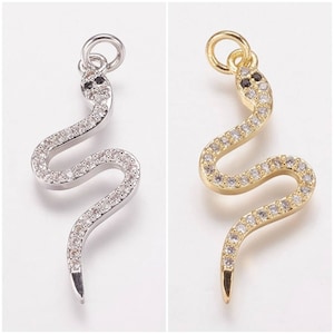 Pendants, snake charms in 18k gold plated or 955 platinum plated, or Gunmetal with zircon. Sold individually.