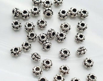 Perles séparateurs style tibétain argent antique 5mm ou 6mm. Lot de 20 perles.