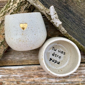 Gold heart mug announces pregnancy "You're going to be a dad"