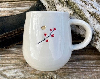 Mug sprig of red heart flowers and gold heart