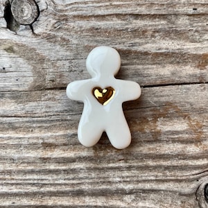 Fève manele little porcelain man with a heart of gold