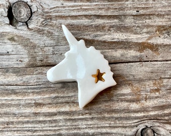 Gold star porcelain unicorn bean