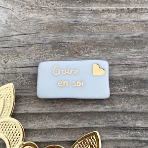 Fève au cœur d’or message positif « croire en soi »