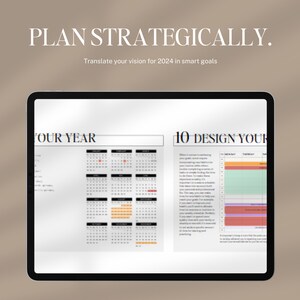 May include: A tablet screen displaying a calendar planner with the text "PLAN STRATEGICALLY. Translate your vision for 2024 in smart goals" at the top. The calendar is divided into two sections: "FOUR YEAR" and "10 DESIGN YOUR".
