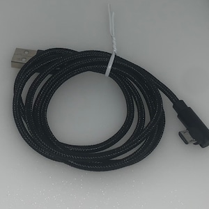 May include: Black USB charging cable with a braided design. The cable has a USB-A connector on one end and a micro-USB connector on the other end. The cable is coiled and secured with a white cable tie.