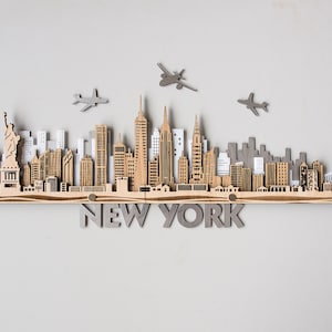 Art mural en bois découpé au laser sur la ligne d&#39;horizon de la ville de New York en superposition de paysages urbains en bois
