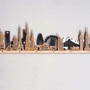 Art mural 3D découpé au laser en couches colorées de paysage urbain en bois d&#39;horizon du monde