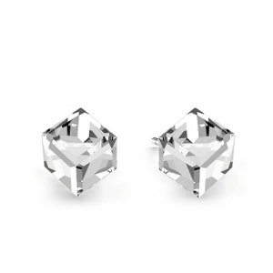 May include: A pair of silver earrings with clear cubic zirconia stones. The stones are cut into a cube shape.