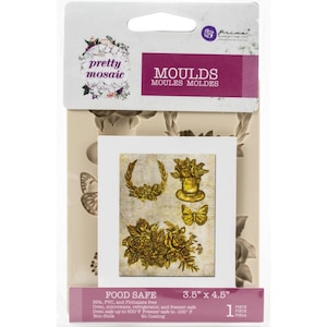 May include: A silicone mold for baking or crafting, featuring a floral design with wreaths, roses, and butterflies. The mold is 3.5 inches by 4.5 inches and is food safe, oven safe up to 500 degrees Fahrenheit, and freezer safe to -100 degrees Fahrenheit.