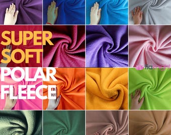 Könnte beinhalten: Ein Raster aus sechzehn Quadraten, die verschiedene Farben von Polarfleece-Stoff zeigen, darunter Lila, Blau, Grau, Pink, Orange, Gelb, Grün, Oliv und Beige. Der Text SUPER SOFT POLAR FLEECE ist auf der linken Seite des Bildes überlagert.