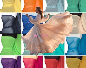 May include: A collage of sheer fabric swatches in various solid colors including yellow, orange, light blue, green, dark gray, blue, lime, beige, purple, pink, red, and gold, surrounding a central image of a flowing beige dress with the text tianight.